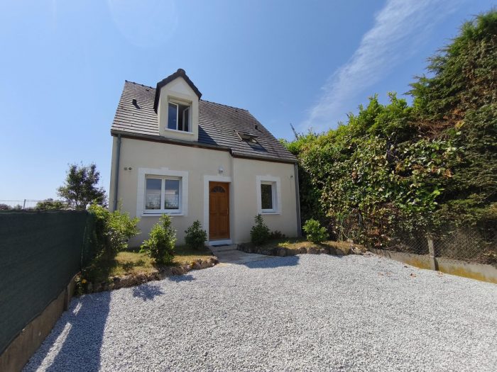 Maison Maison avec jardin et garage.